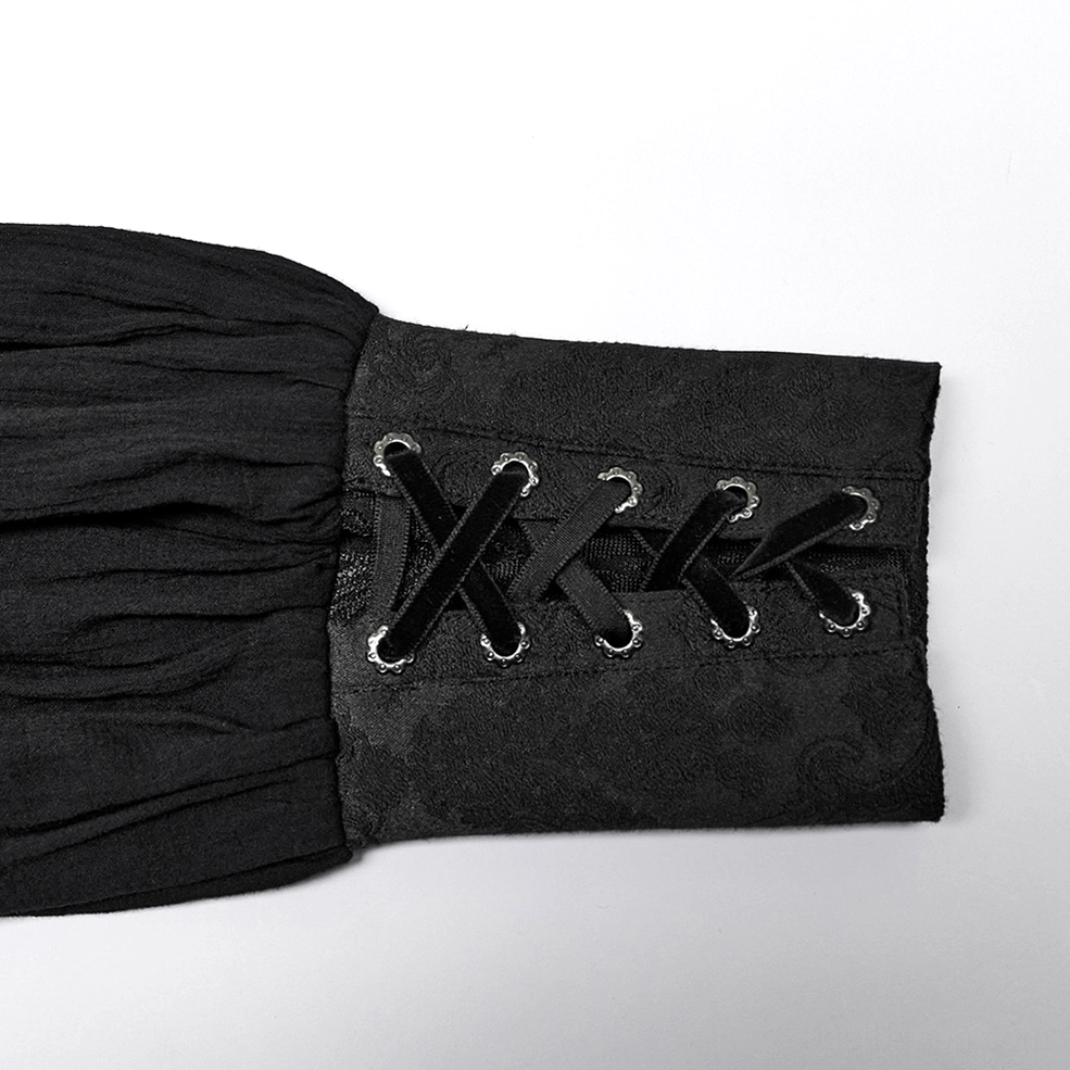 Close-up detail of gothic shirt cuff showing velvet lace-up straps, metal eyelets, and ruched fabric