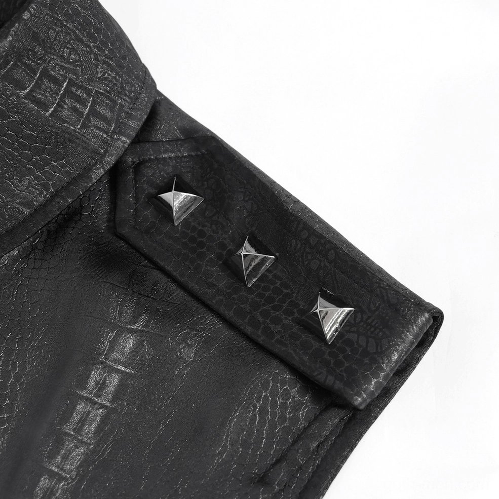 Detailed view of gothic sleeveless shirt epaulet with pyramid metal studs and crocodile textured polyester fabric