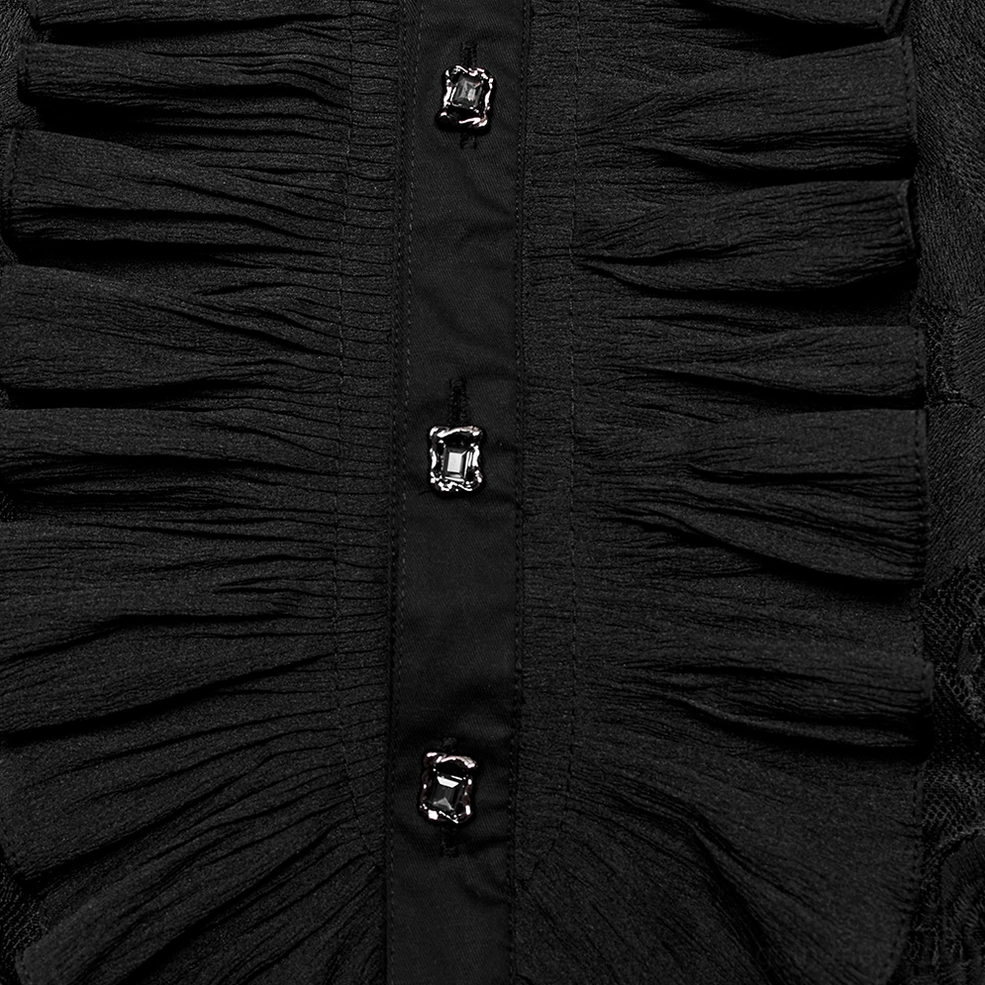 Close-up detail of black gothic shirt front placket showing ruched ruffles and metal square decorative buttons