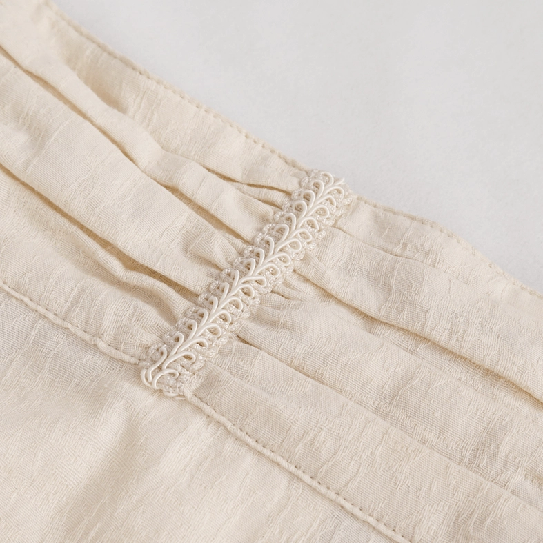 Gothic stand collar shirt front pleat detail close-up, featuring embroidered trim and soft gathered fabric pleats