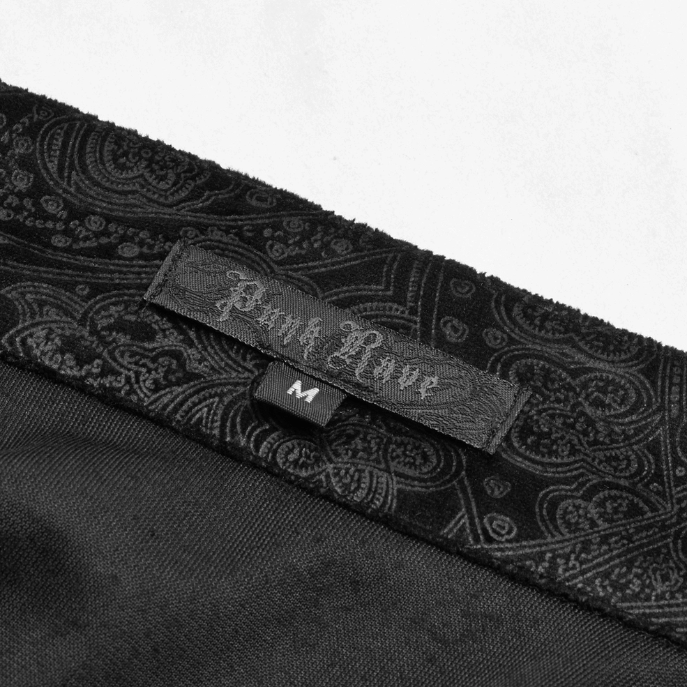 Close-up of interior brand tag and size label on black gothic dress shirt with paisley jacquard fabric detail