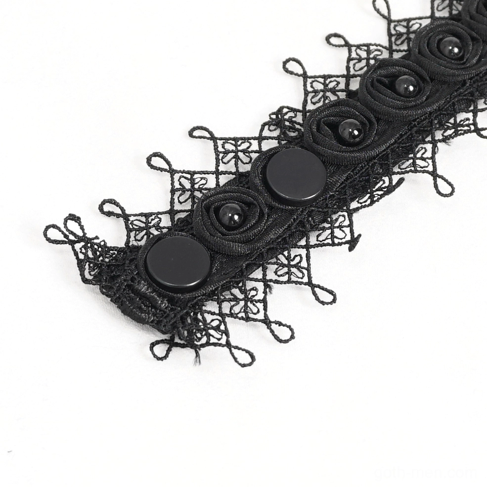 Close-up flat lay of black lace cuff decoration with fabric rosettes and round button accents from gothic shirt