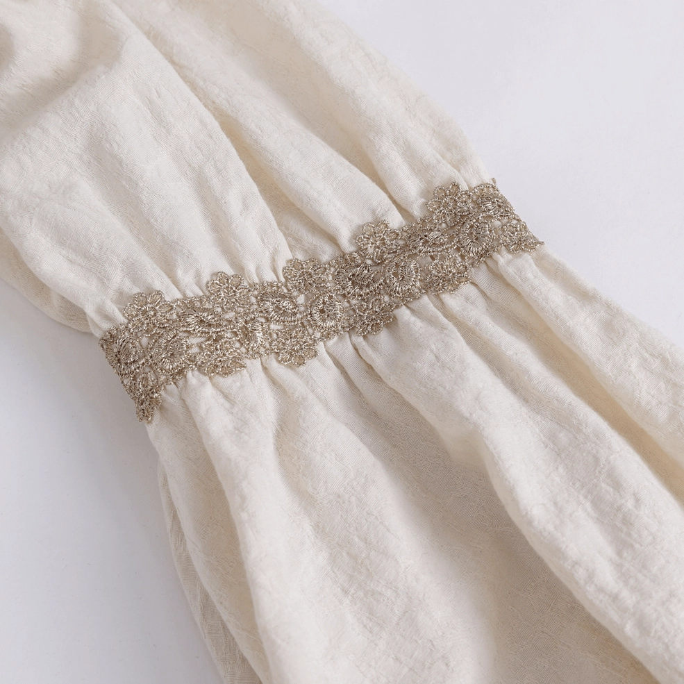 Lace trim and metal fastener details on gothic ruffled shirt front placket