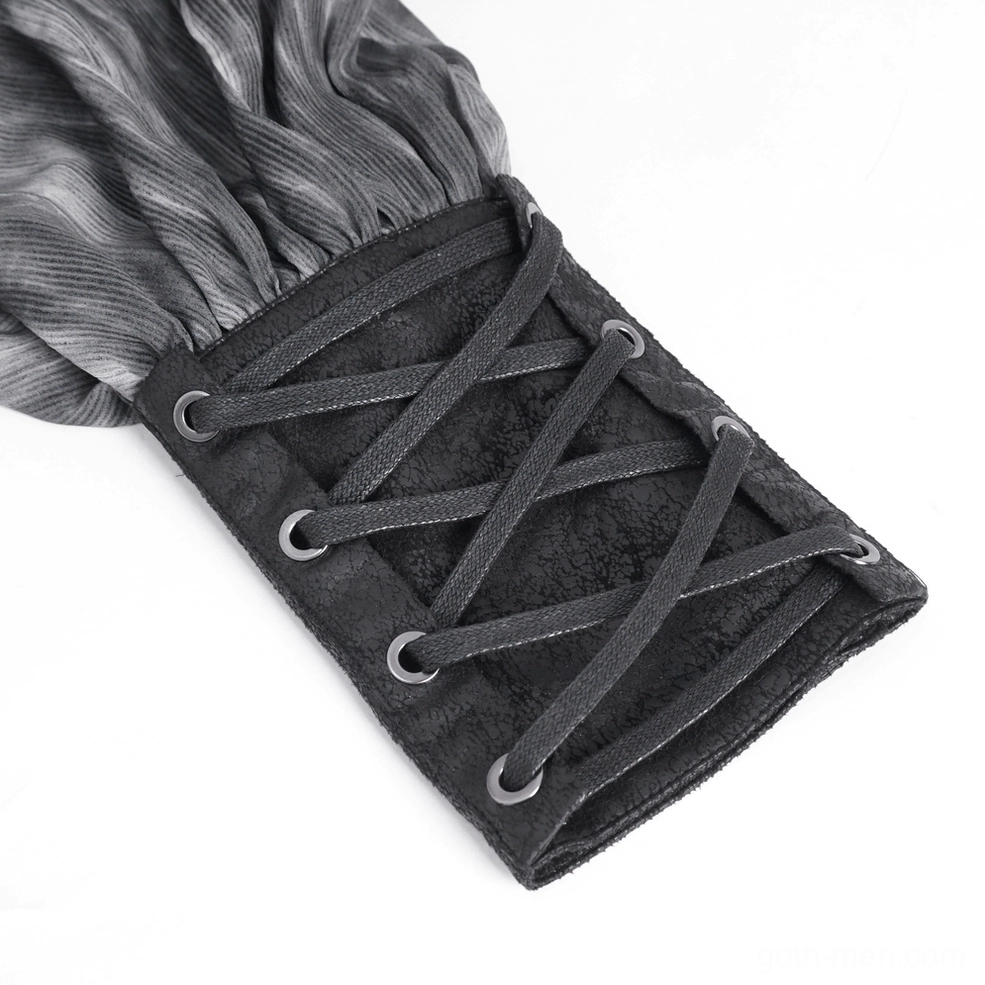 Top-down close-up of lace-up faux leather cuff with black fasteners and marbled grey shirt fabric composition
