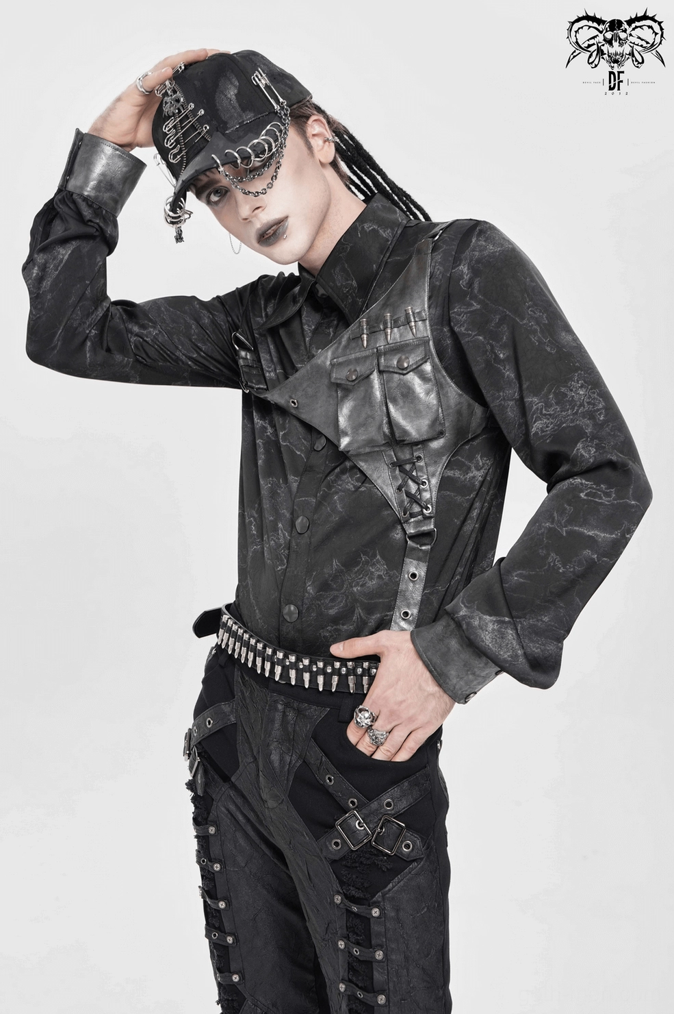 Hardware and metal buckle details on PU leather harness of black gothic button-up shirt