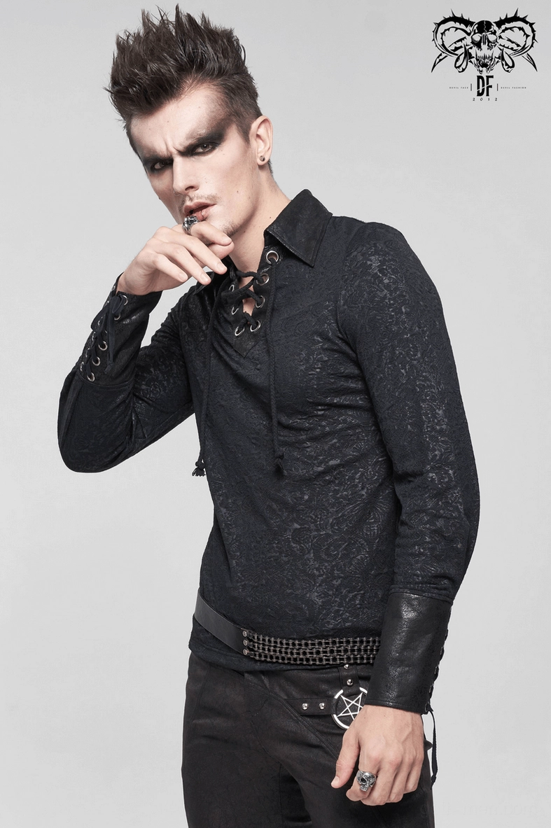 Male model wearing black gothic lace-up dress shirt with pentagram detail pants alternative styling
