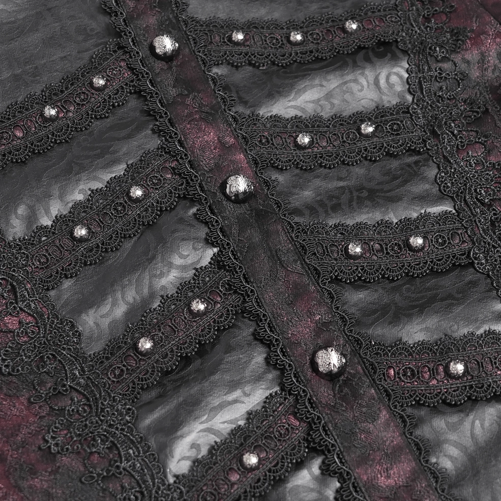 Detailed close-up of front placket showing embossed fabric, ornate lace trim, and studded metal buttons