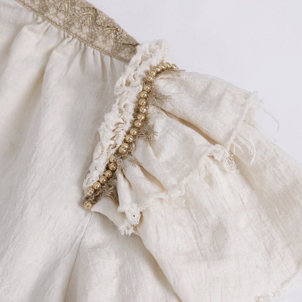 Victorian gothic ruffled shirt sleeve ruffle texture and construction detail