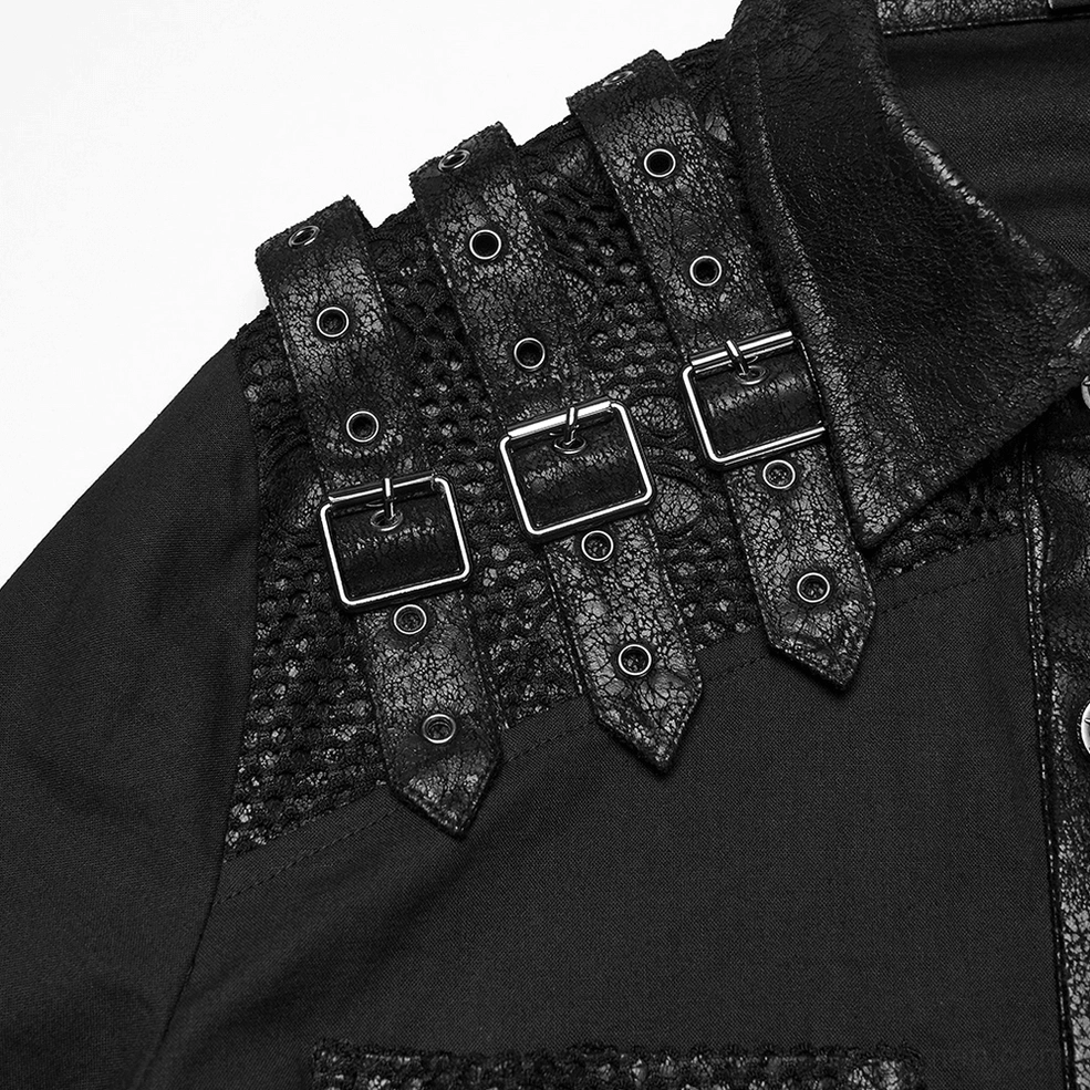 Close-up of shoulder buckle hardware and mesh paneling on black gothic shirt - industrial goth construction detail