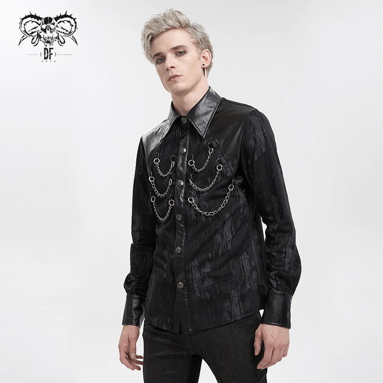 Black gothic shirt cuff and sleeve detail highlighting metal snap closure and fitted sleeve taper