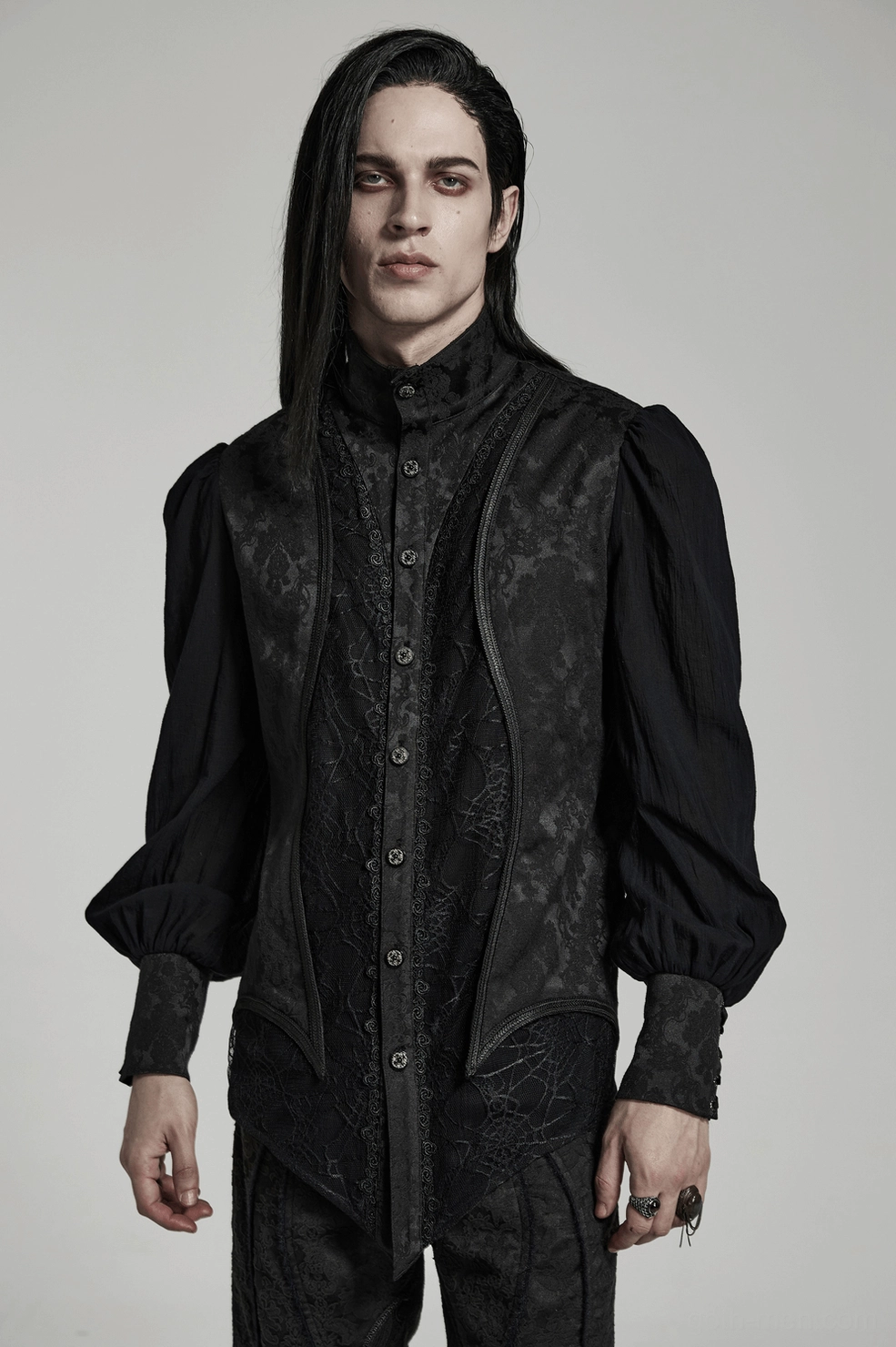 Detailed view of gothic shirt stand collar and shoulder seam construction showing tailored fit