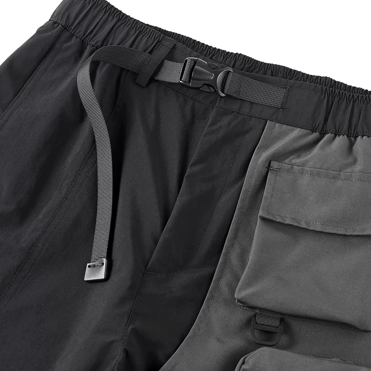 Left side profile of black gothic cargo shorts with adjustable buckle and flap pocket construction