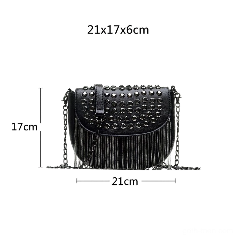 Black studded shoulder bag side profile view showing dimensions 21x17x6cm, structured flap design with tassel trim