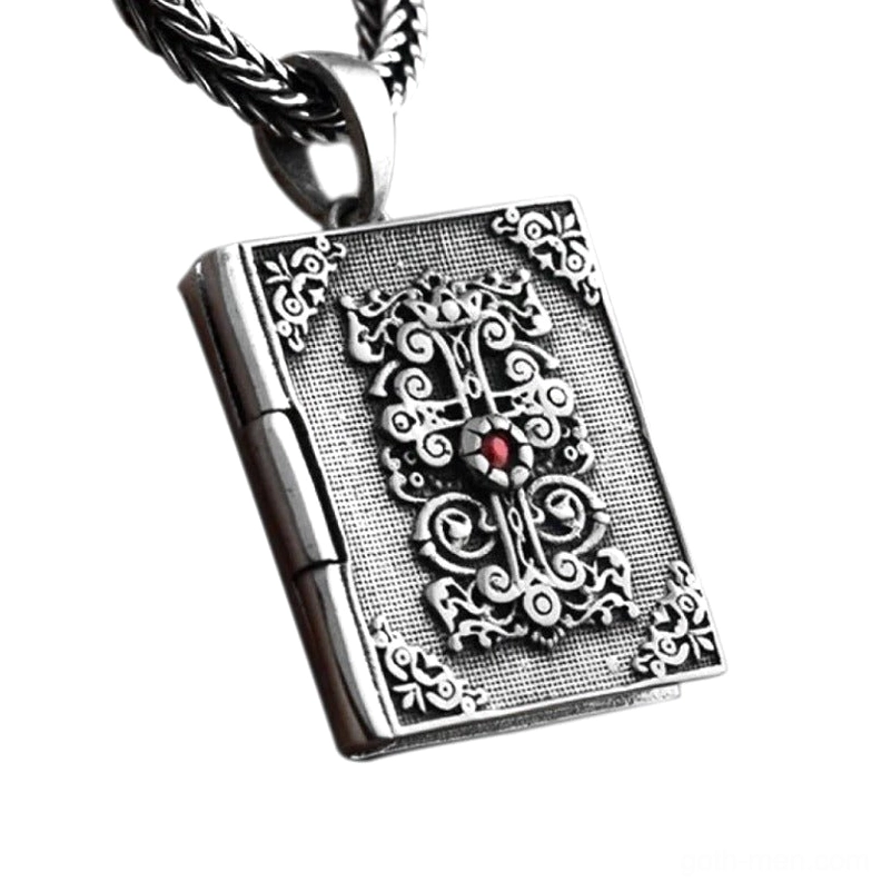 Sterling silver gothic bible locket pendant with ornate cross and embossed scrollwork, three-quarter view showing detailed religious book design
