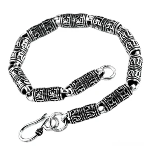 Two silver engraved cylindrical bracelets showing different length options, angled side view on white background with carved tube links