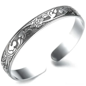 Gothic ornamental silver open cuff bracelet with embossed ethnic floral pattern - antique finish front view