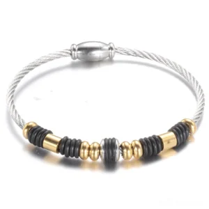 Gothic silver magnetic charm bracelet with two-tone beaded design and twisted cable band, front view flat lay on white background