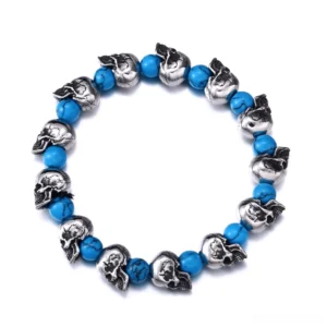Silver skull bead elastic gothic bracelet with blue stone accents, flat lay top view on white background
