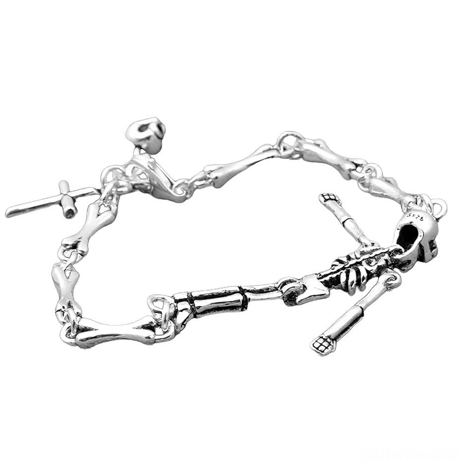 Unisex skull skeleton silver bracelet with cross accent, angled flat lay displaying intricate bone links and vintage patina