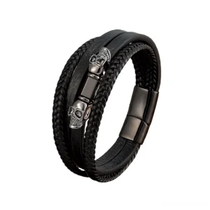 men's gunmetal black skeleton dual skull leather bracelet flat lay side view magnetic clasp