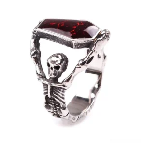 Unisex gothic skeleton ring with red coffin stone - side oblique angle showcasing antique silver-tone finish and stone setting
