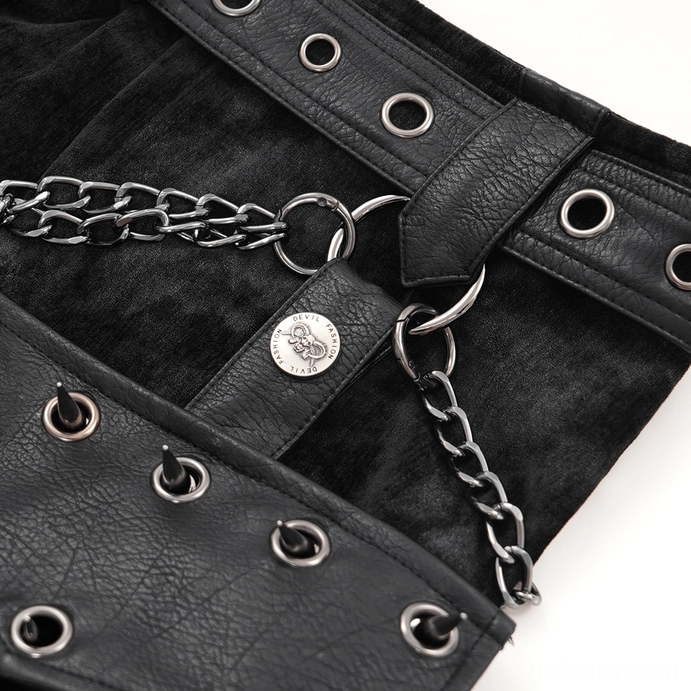 Gothic split skirt metal rivets chain hardware and branded leather tag accessory detail