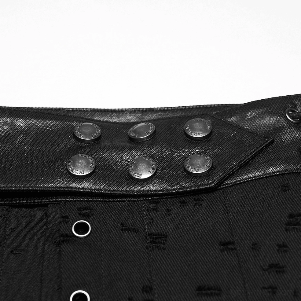 Close-up of waistband fasteners including round metal snap buttons and grommet holes
