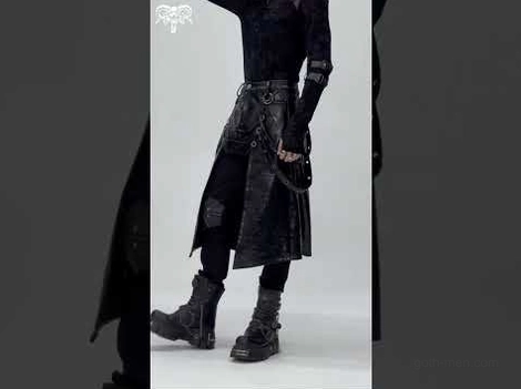 Full-body styling shot of black gothic faux leather utility skirt paired with combat boots and dark outfit