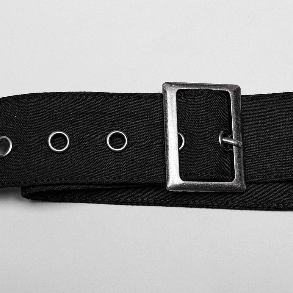 Close-up of silver rectangular metal buckle and adjustment eyelets on gothic skirt waist strap hardware
