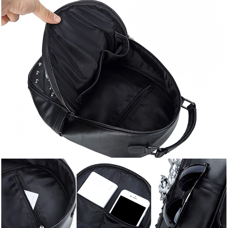 Empty gothic skull backpack open interior showing black lining and zipper closure