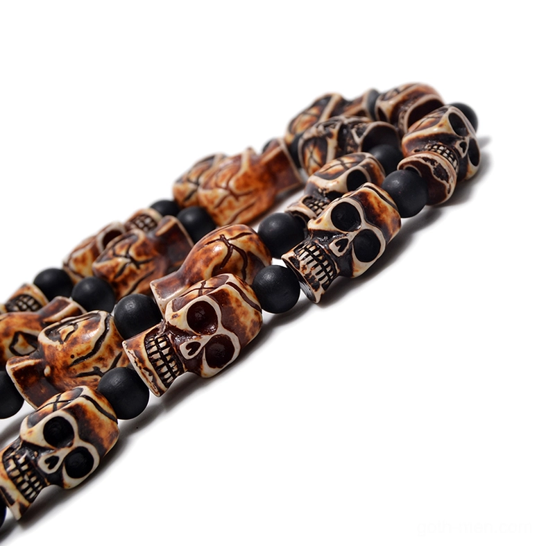 Light tan aged skull beads partial strand gothic necklace with black spacers