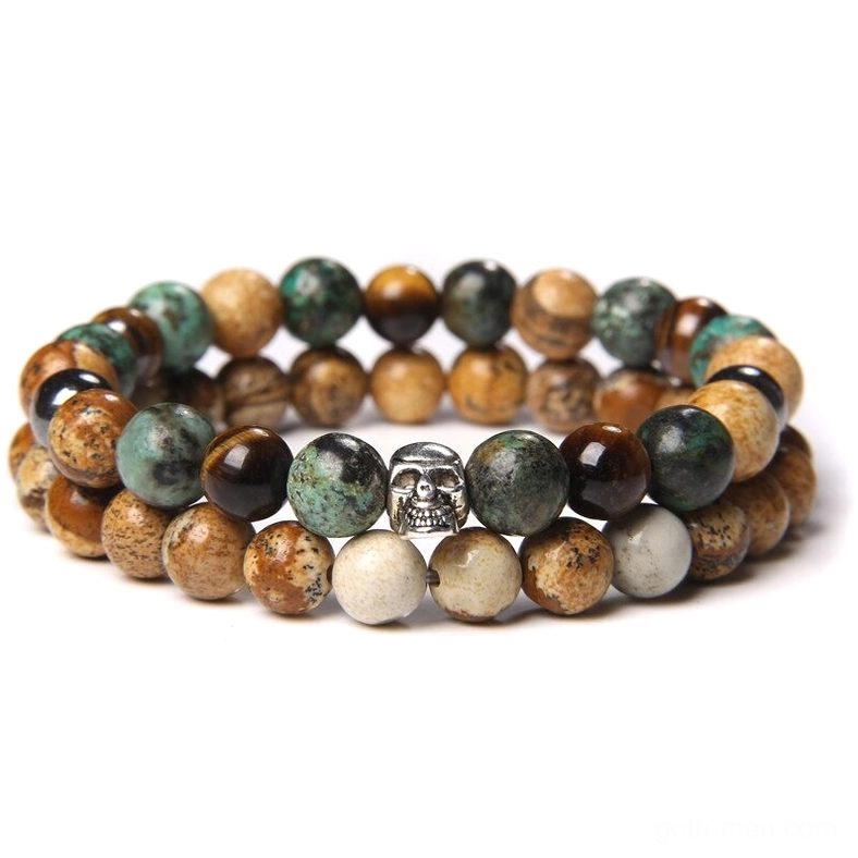 Gothic skull stone beaded bracelet with mixed natural stone beads and silver skull metal charm, overhead flat lay view