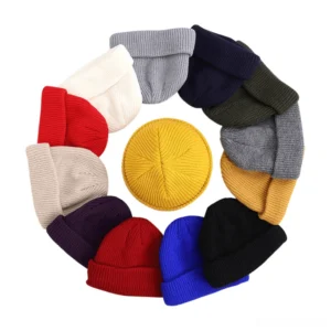 Multiple color gothic skull beanies collection - burgundy, navy, purple, grey, yellow, khaki - top-down circular arrangement
