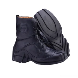 Black leather gothic combat boots with skull embossing and rugged outsole tread pattern