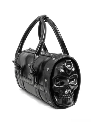 Black gothic skull bowling bag with metal rivets, side-front view showing 3D skull design and dual top handles