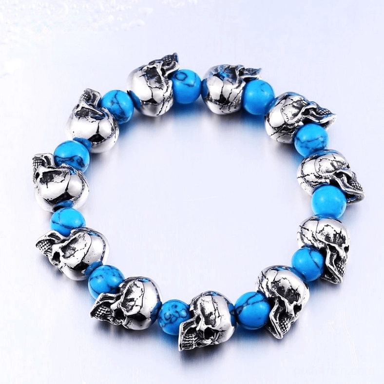 Angled view of punk style skull head beaded bracelet displaying side profile and bead arrangement