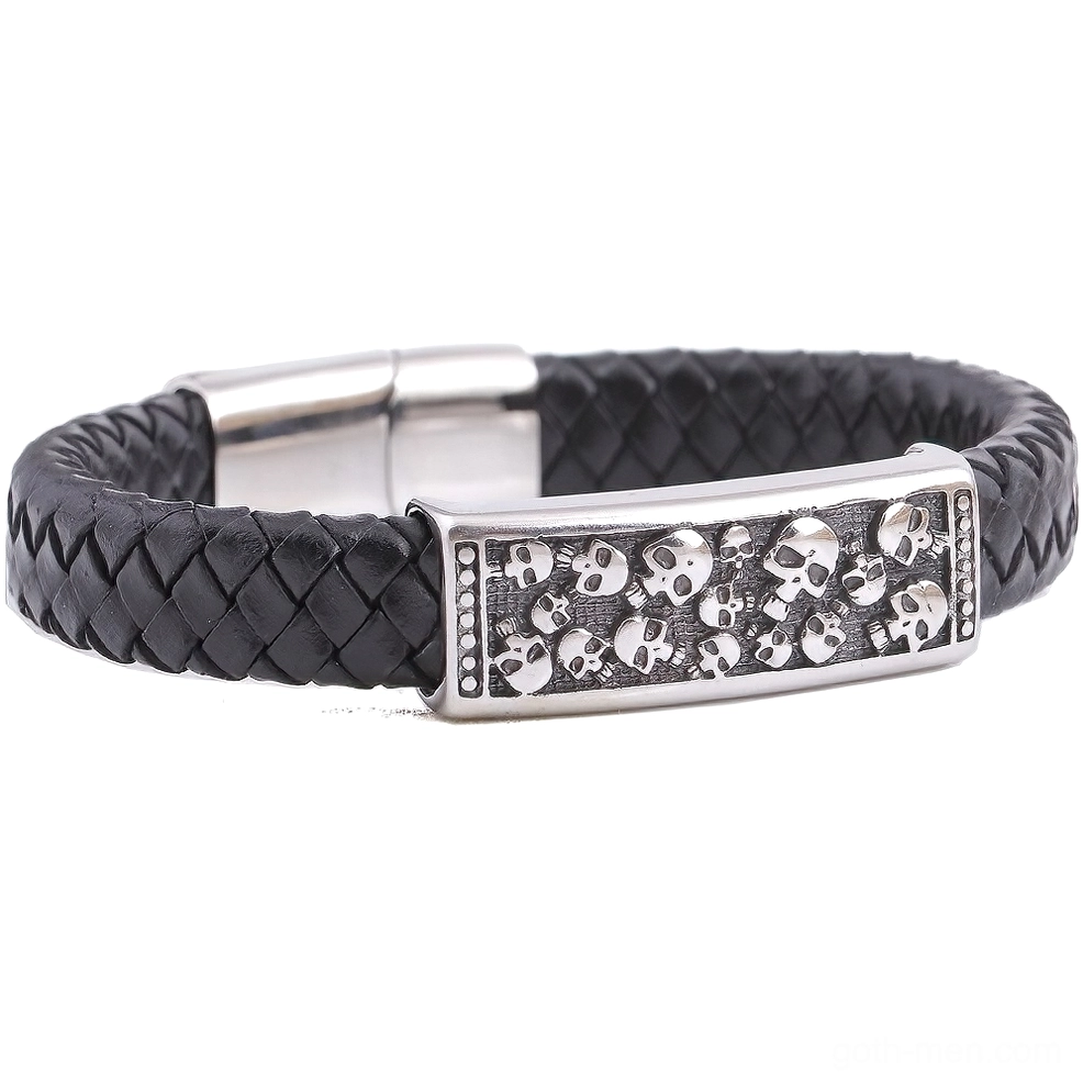 Overhead flat lay of gothic leather skull wrap bracelet showing engraved skull embellishment and magnetic clasp design