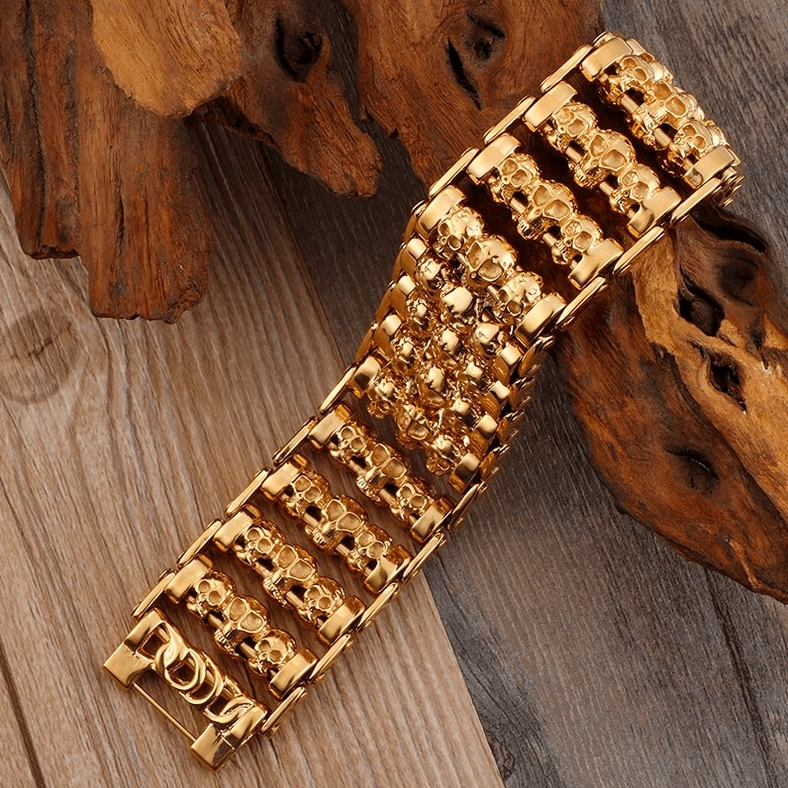 Gothic skull chain bracelet lifestyle shot showing stacked skull links and fold-over fastening