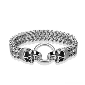 Men's Gothic Skull Bracelet - Stainless Steel Wheat Link Chain with Dual Skull Pendants, Flat Lay Front View