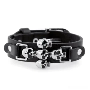 Multiple skull leather gothic bracelet design featuring dual leather straps with several silver skull ornaments