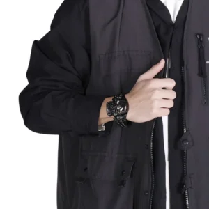 Gothic skull bracelet worn on male wrist with black outerwear demonstrating how-to-wear and styling