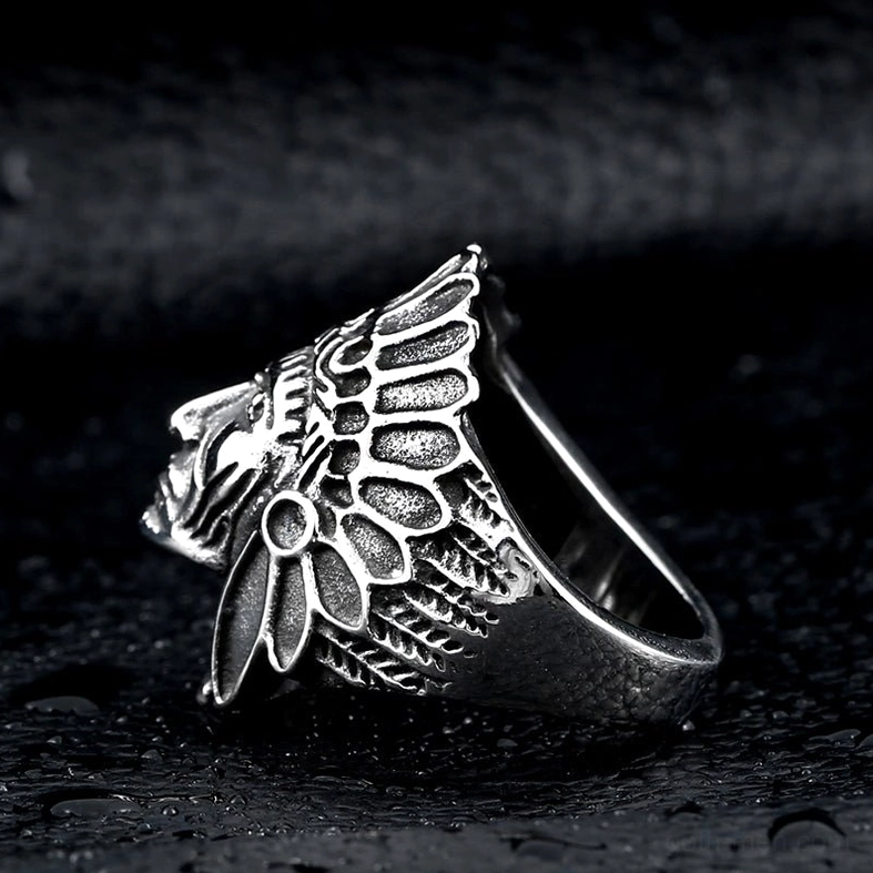 Side profile view of gothic skull chief ring showing open band and detailed tribal side carvings in silver