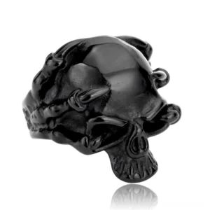 Matte black stainless steel skull biker ring with skeleton hand claws, side profile angle displaying the sculptural depth and dark gothic aesthetic