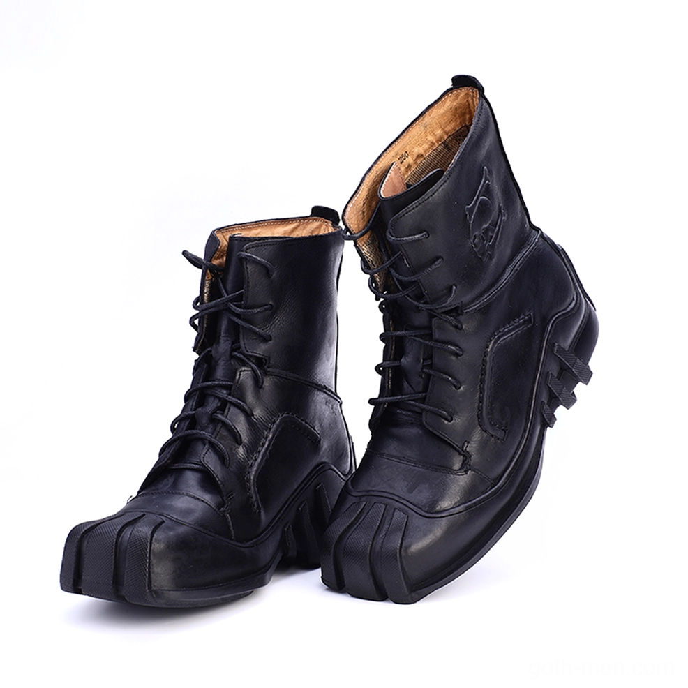 Pair of black leather gothic combat boots with all-black finish embossed skull logo tilted angle