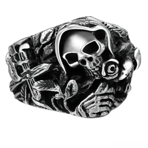 925 sterling silver gothic skull ring with flower and cross carved details, antiqued silver finish, front view on white background