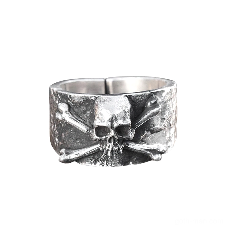 Adjustable sterling silver skull and crossbones gothic ring front view flat lay showing textured band design