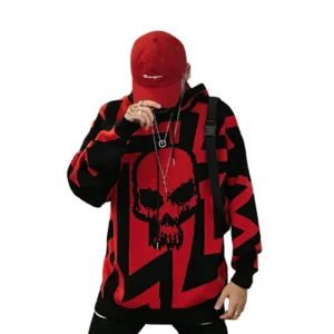 Red and black geometric skull print oversized gothic knit hoodie front view on male model
