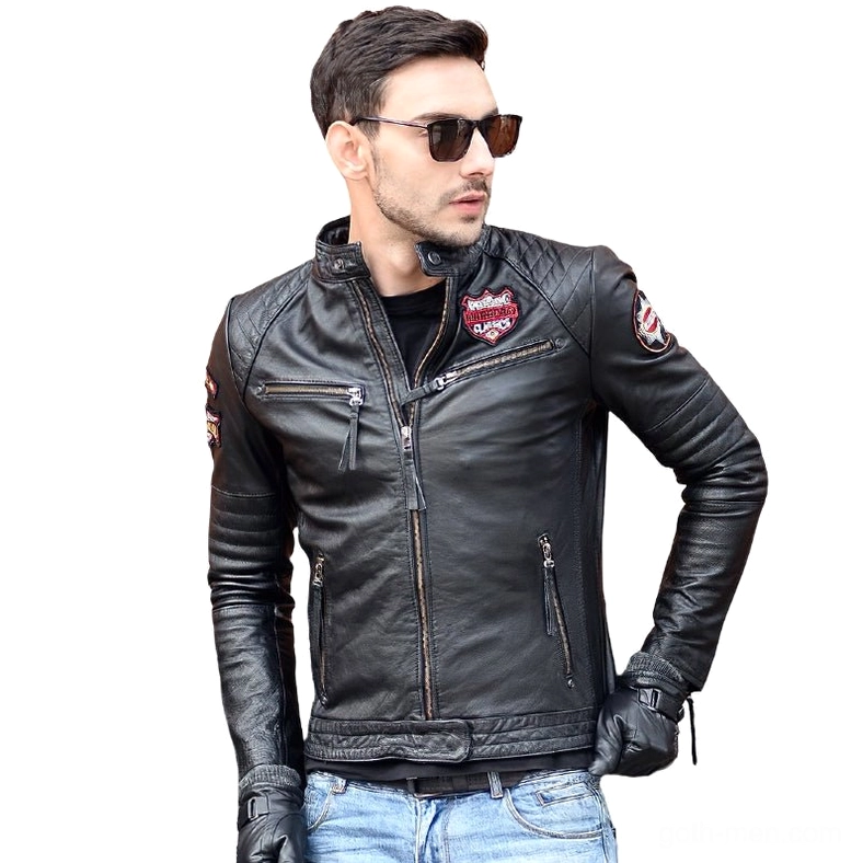 Model wearing black genuine leather gothic motorcycle jacket three-quarter view with jeans and riding gloves