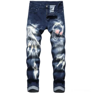 Navy blue distressed denim jeans with pink-eyed skull print and bleached faded design front view