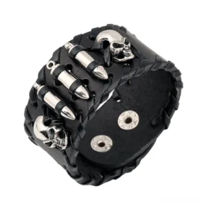 Black braided leather gothic skull bracelet with silver metal skull charms and bullet studs, overhead studio view showing detailed punk-inspired design